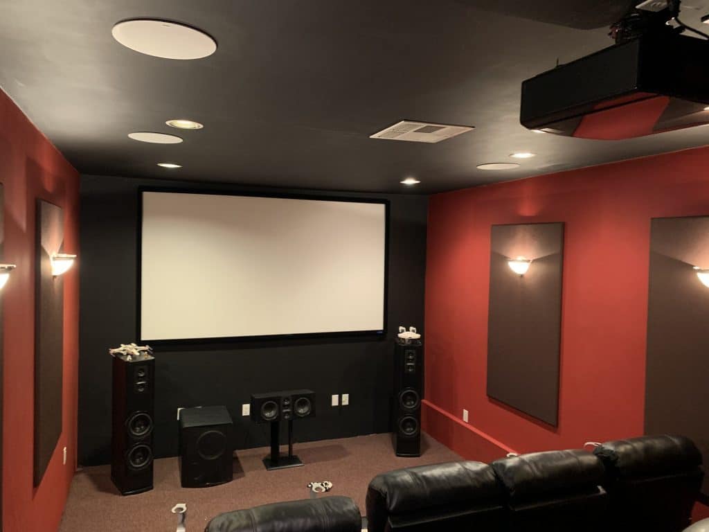 Home theatre with red and black walls waiting for an audience
