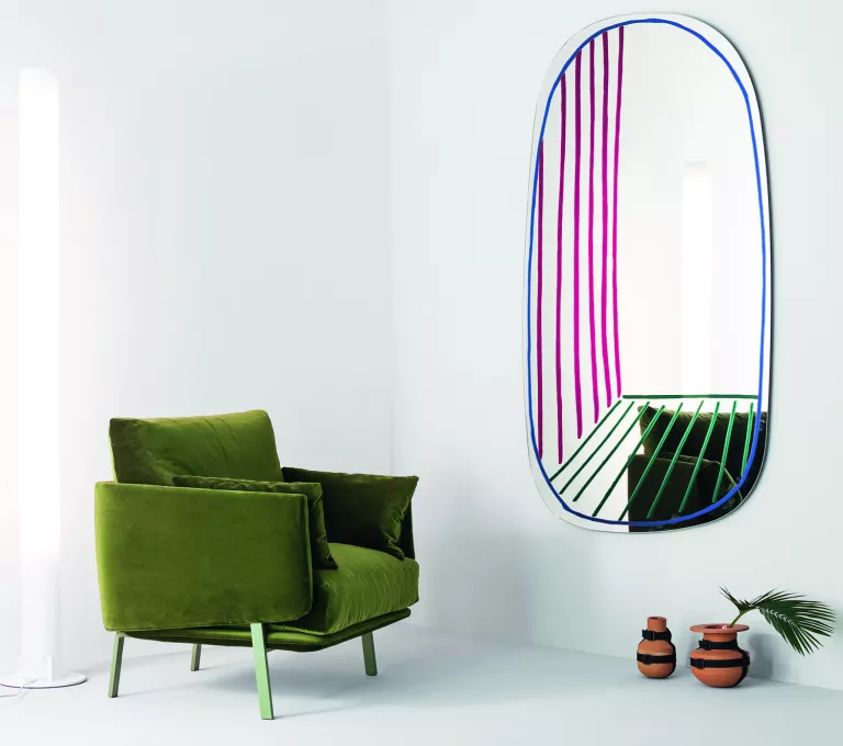 A contemporary room with an oval mirror that has had lines panted on by hand, to give the Trompe L’oeil effect, as found on HomeDecorCraze